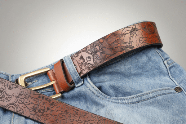 Mahakala & Yamantaka Leather Belt featuring laser-engraved line art of Tibetan Buddhist wrathful deities Mahakala and Yamantaka, crown of five skulls, multi-limbed forms, and sacred Vajrayana symbols on premium oil pull-up leather, symbolizing protection, transformation, and spiritual strength