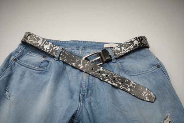 The Abstract Series Pearl Metallic Leather Belt featuring laser-etched abstract patterns hand-painted with shimmering silver-pearl pigment on premium dark leather, finished with a special alloy buckle